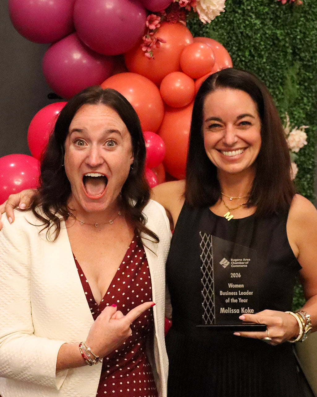 Melissa Koke holding her 2026 Women Business Leader of the Year award at a Eugene Area Chamber of Commerce celebration.